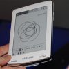 Samsung_E6_eReader_Natural_White_Front_Center_Hand_Man_Model_Full_Body_Dandygadget_Portable_Media