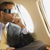 Epson_Moverio_BT_100_Wearable_Display_Cute_Black_Glasses_Cute_Male_Model_On_Plane_Dandy_Gadget_Portable_Media
