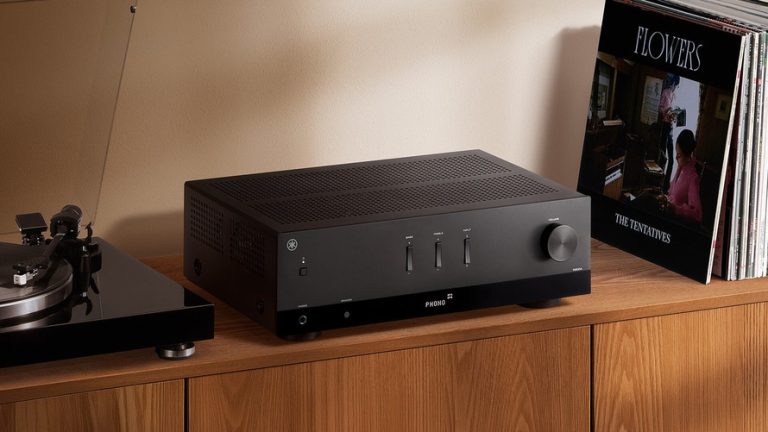 Black Yamaha R200A stereo receiver in a home listening setup